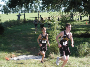 Greg (left) and Matt Haefle run up a slight incline.